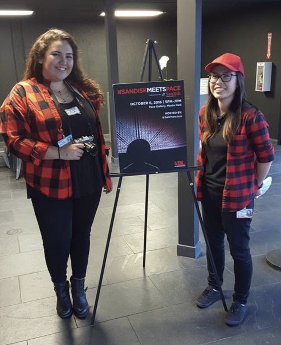 Diana and a teammate next to the #SanDiskMeetsPace event sign